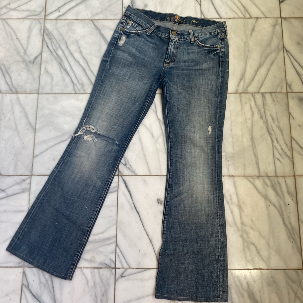 Low Rise Flare Jeans With Hole In The Knee.